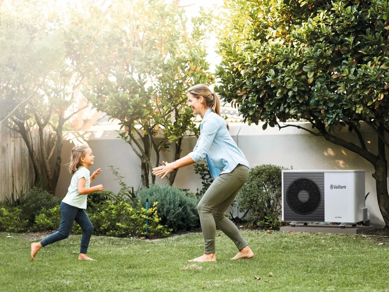 Family in Manchester garden happy with the new heat pump installation